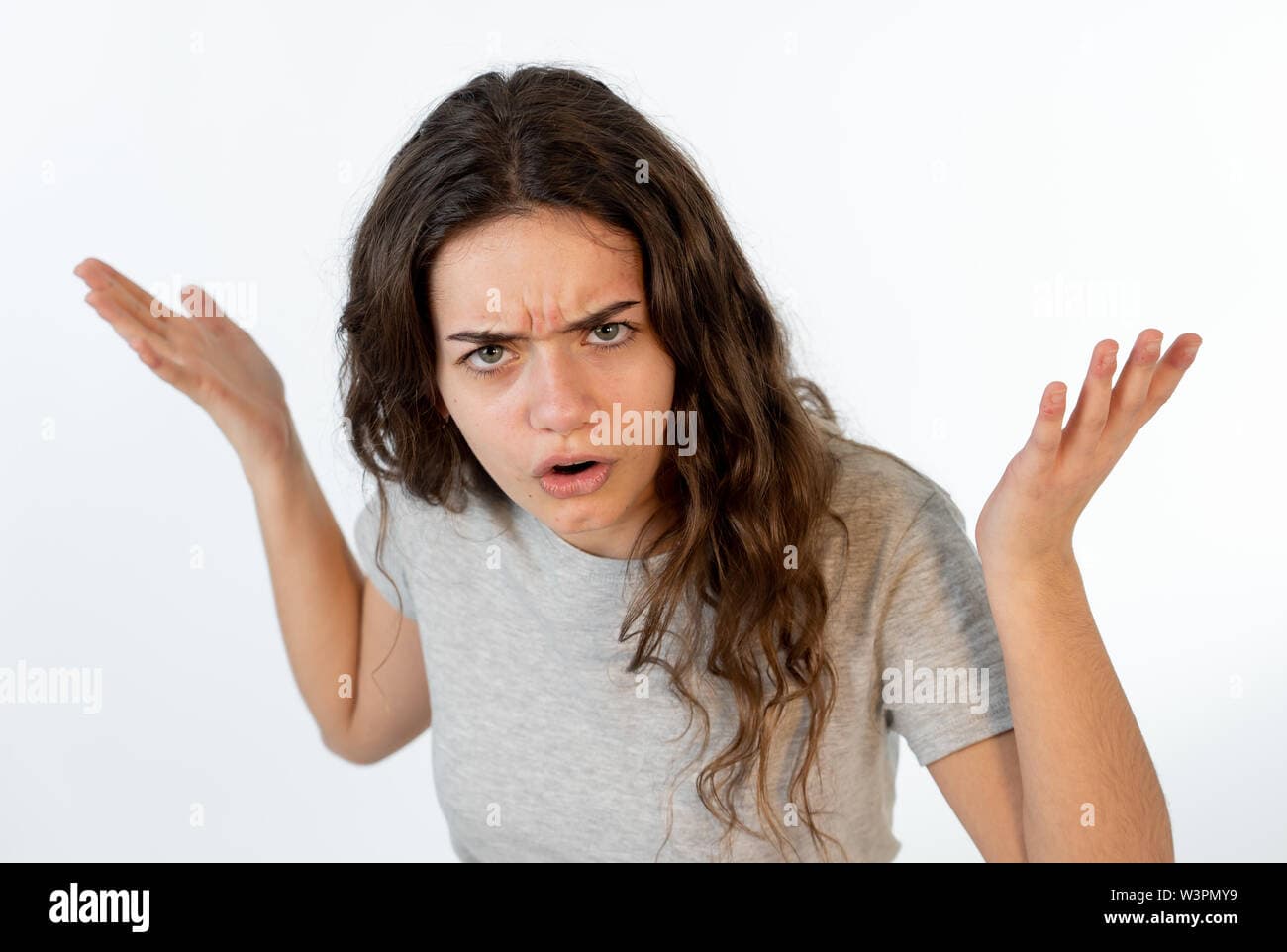 close up portrait of a pretty young caucasian girl with an angry face looking outraged and mad looking at the camera human facial expressions and em w3pmy9